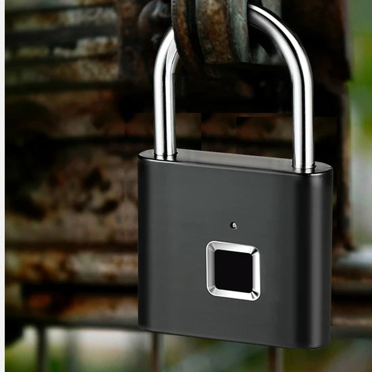 Black smart fingerprint padlock securing a rusty metal gate outdoors